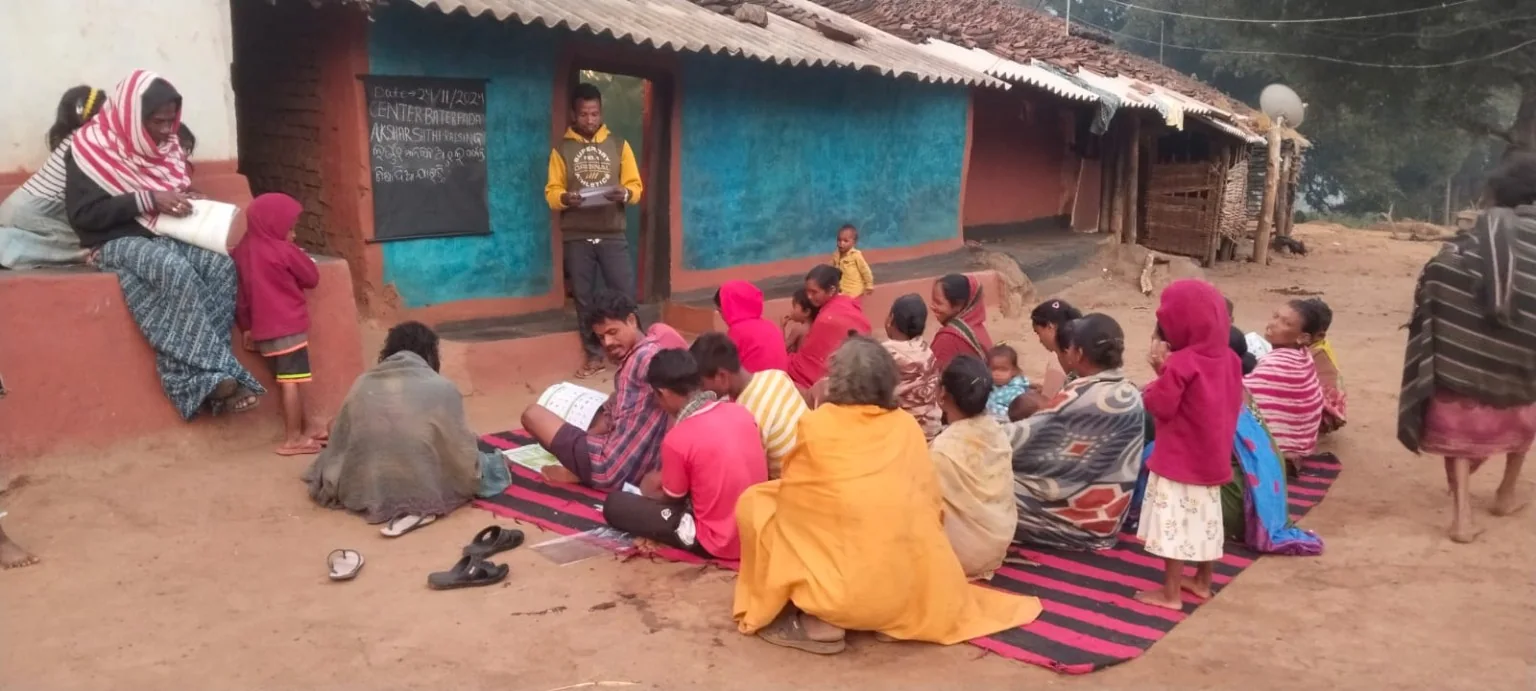 Adult literacy learners gathered for a community learning session.