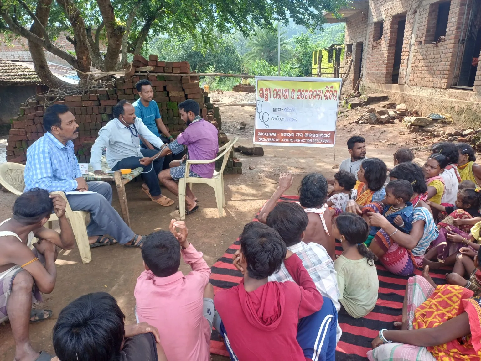 Community members participating in a health check-up and awareness camp organised by CAR.