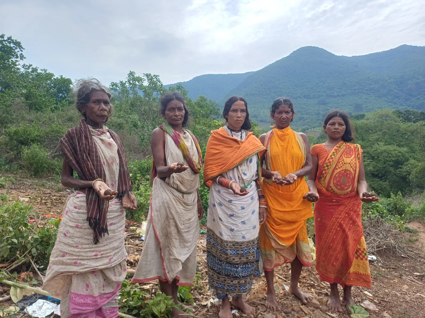 Community members in a rural landscape connected to local livelihoods.